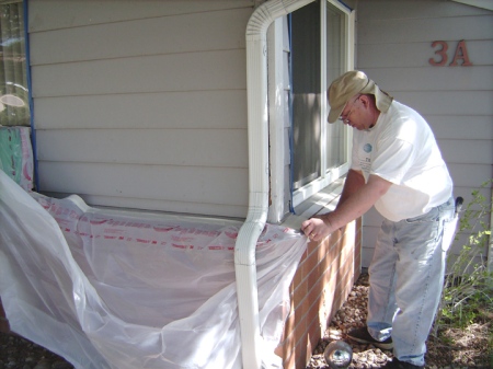 Fred Bealer paints an apartment for the Boulder County Housing Authority as part of the Boulder Colorado Stake’s Colorado Cares Day project on May 12, 2007.
