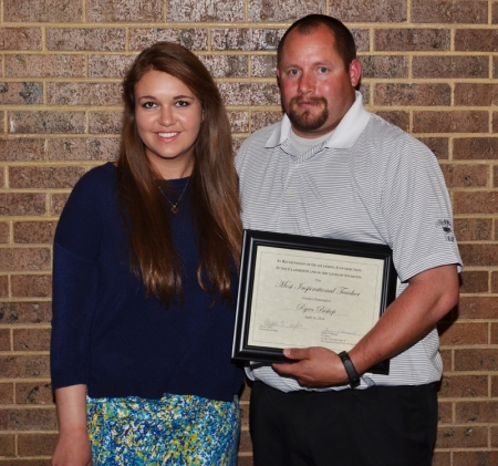 Boulder High School teacher Ryan Bishop, right, received the “Most Inspirational Teacher” award from the Boulder Colorado Stake of The Church of Jesus Christ of Latter-day Saints on April 16, 2014, in its teacher awards night. Alyssa Taylor, left, nominated Bishop.